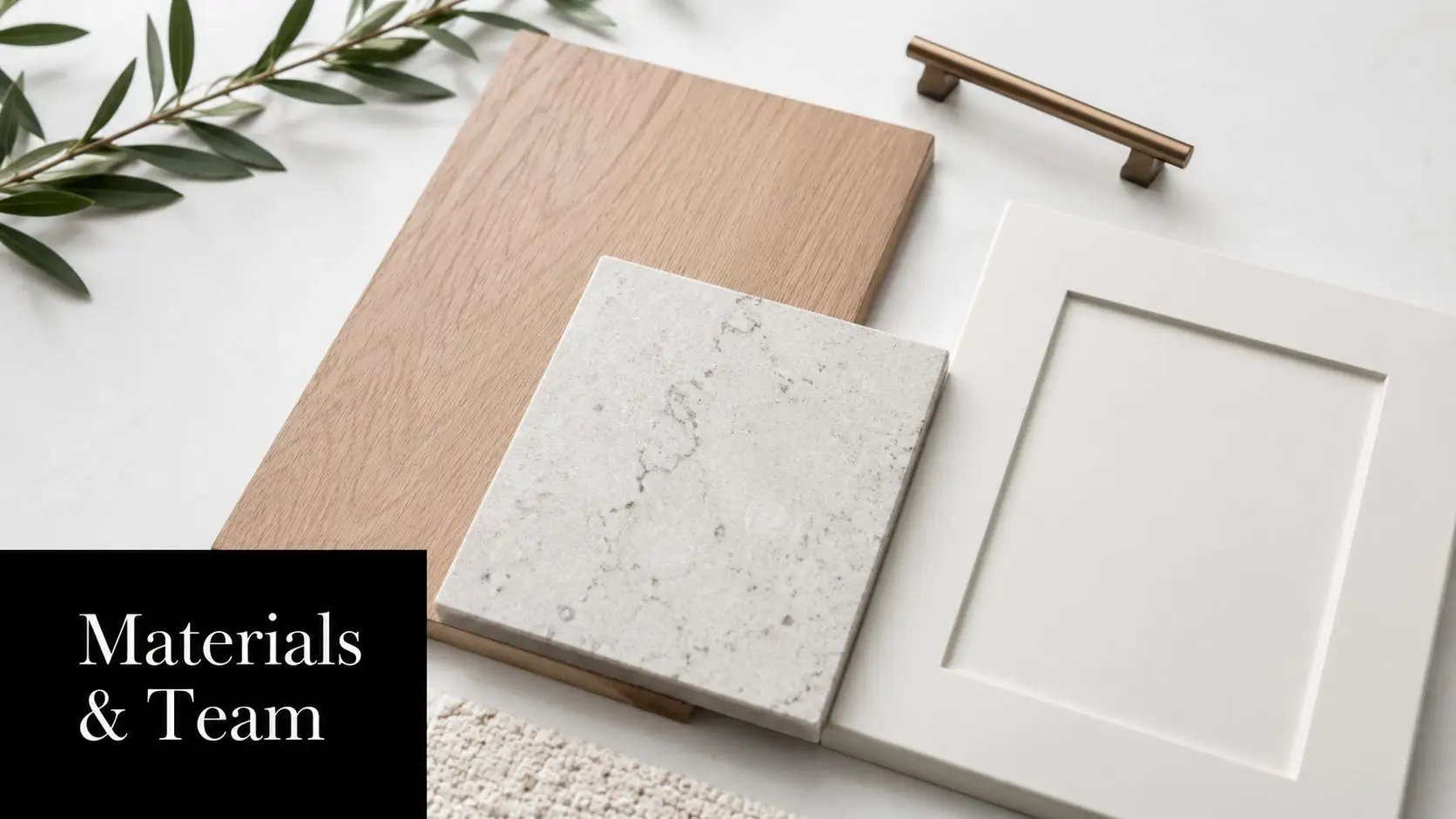 A flat lay of interior design samples including wood veneer, stone countertop, white cabinet door, and handle.