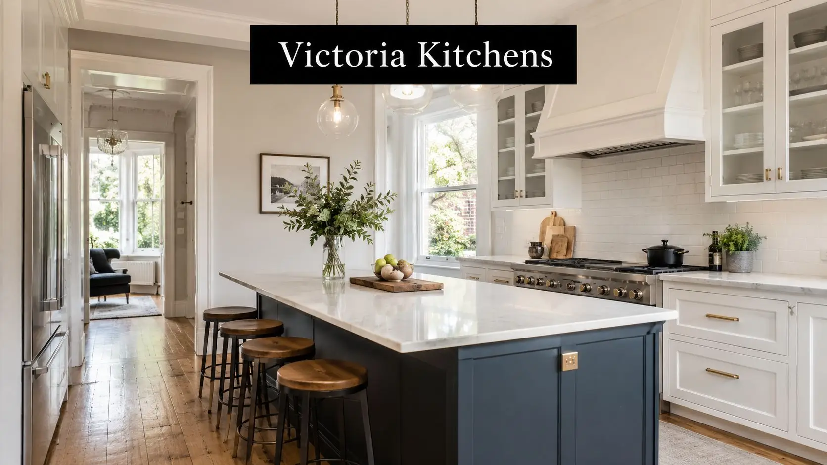 A sophisticated white and navy blue kitchen featuring a large marble island with bar stool seating.