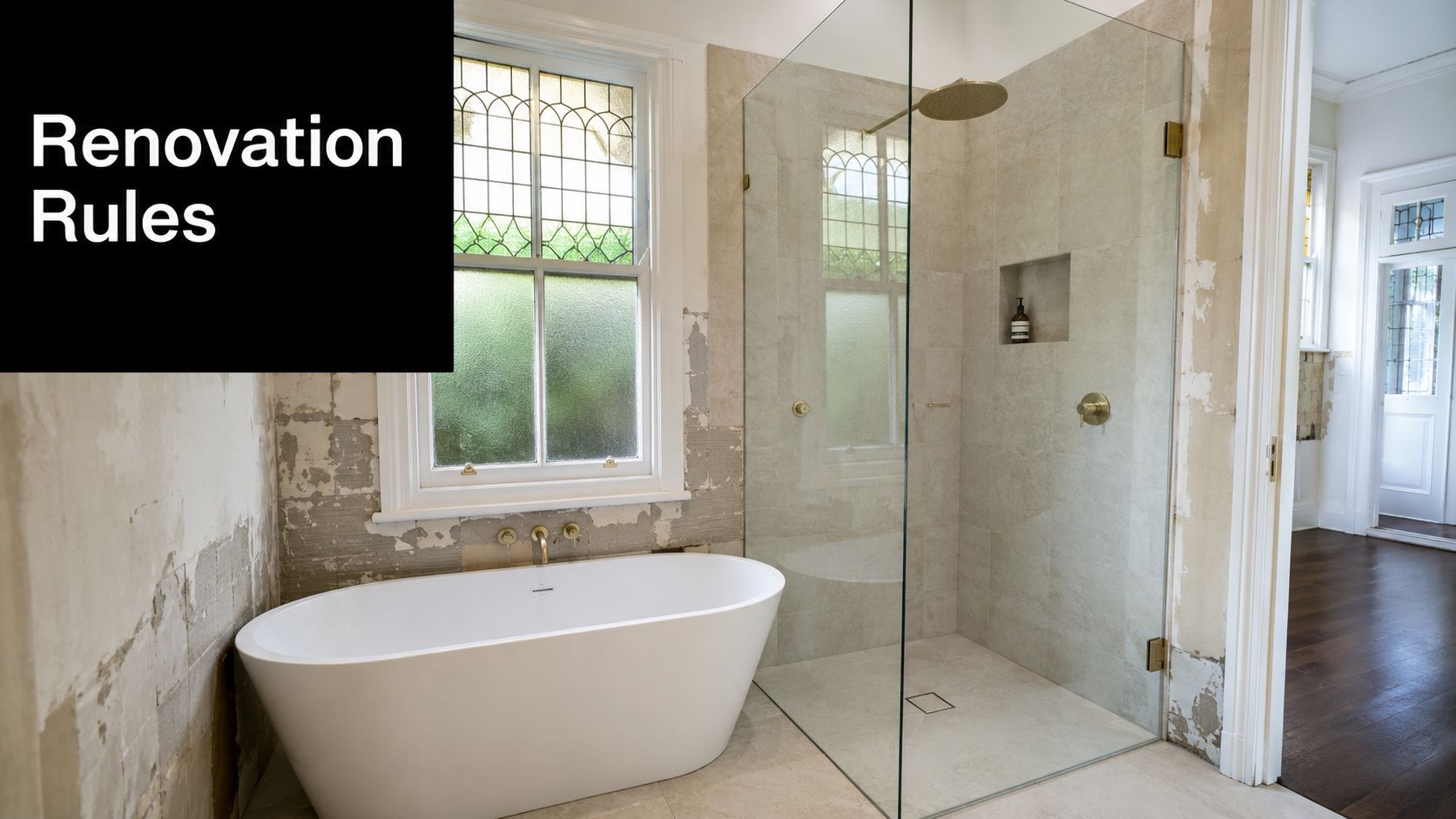 A luxurious bathroom featuring a sleek freestanding white bathtub and a modern frameless glass shower enclosure.